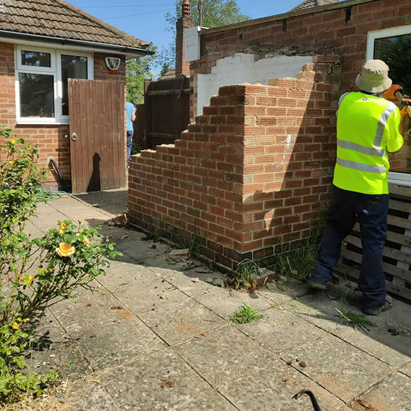 Demolition of a wall and rubbish clearance in Northampton