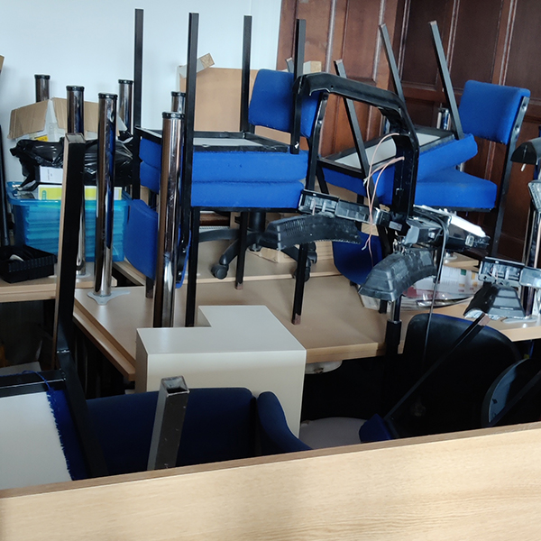 Office furniture piled up for removal