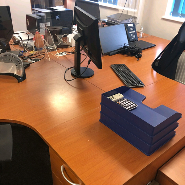 Desks and computer equipment ready for removal